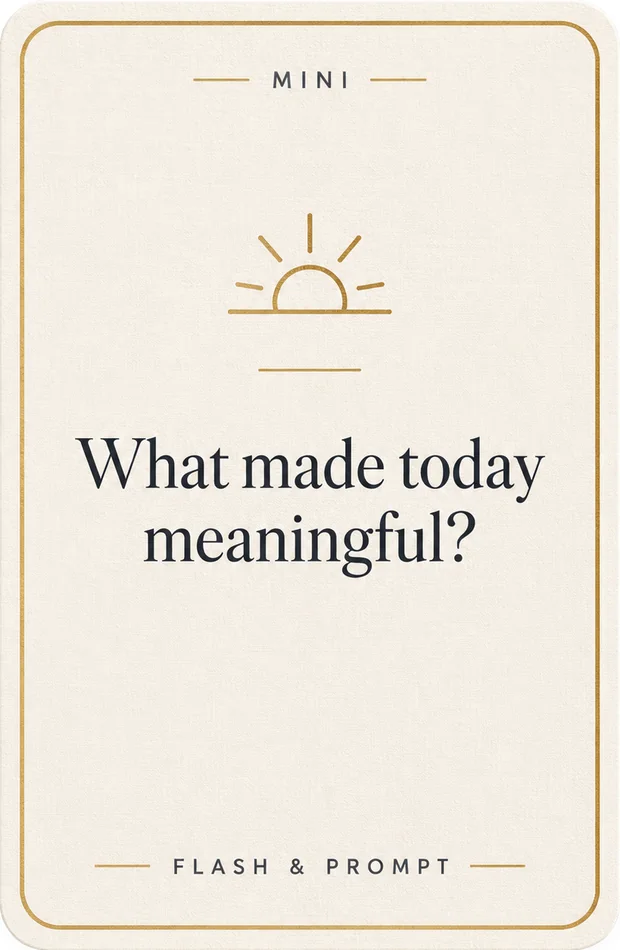 A cream mini prompt card with a gold keyline and a drawn sunrise, reading “What made today meaningful?” over a Flash and Prompt footer