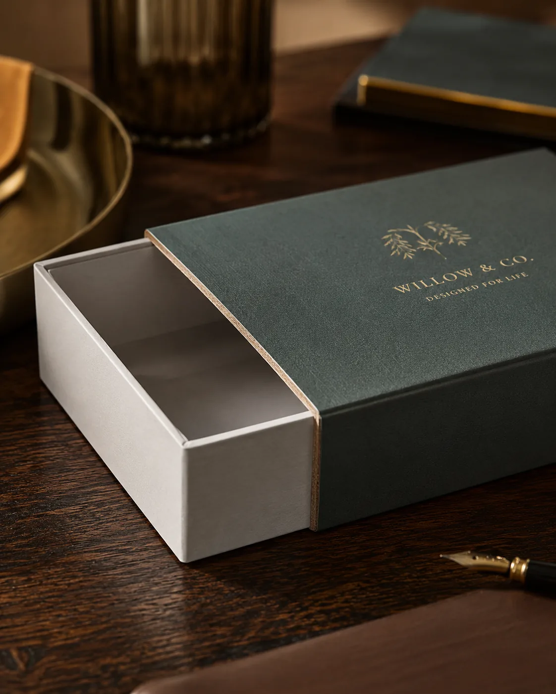 A printed sleeve slid back off a plain inner tray, the thickness of the board visible along the opening