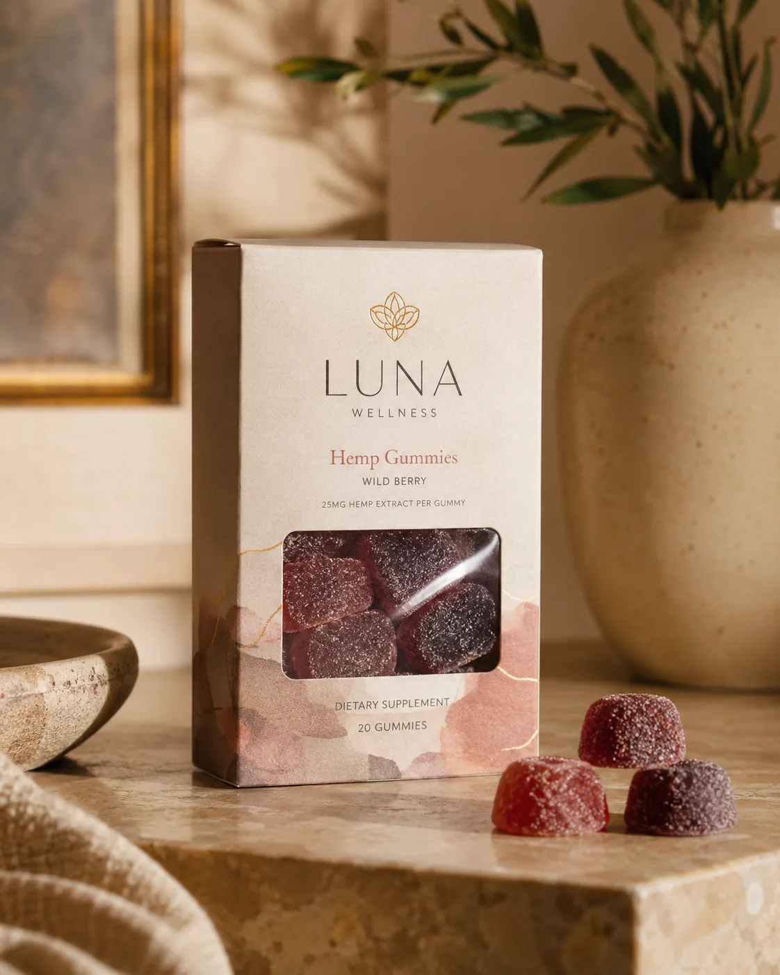 A tall gummy supplement carton on a stone ledge with a wide die cut window low in the front panel, a narrow band of printed board either side of the opening.