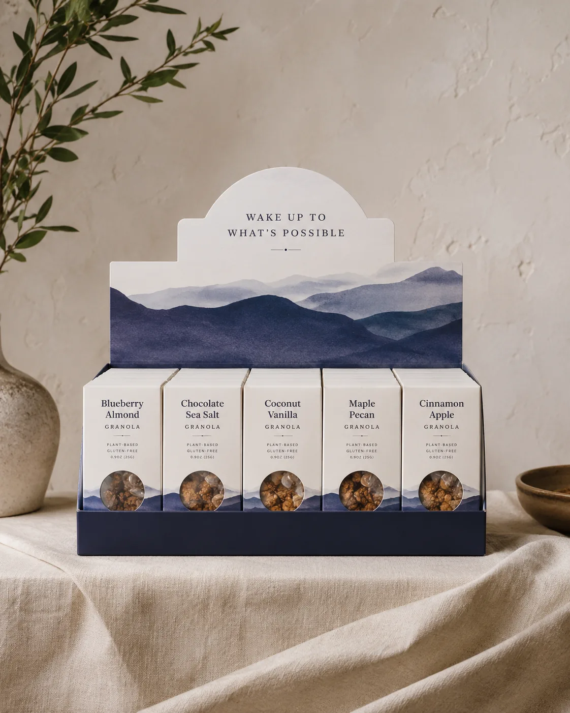 A finished counter display holding a full row of cartons, its printed header upright, shot square on at counter height.