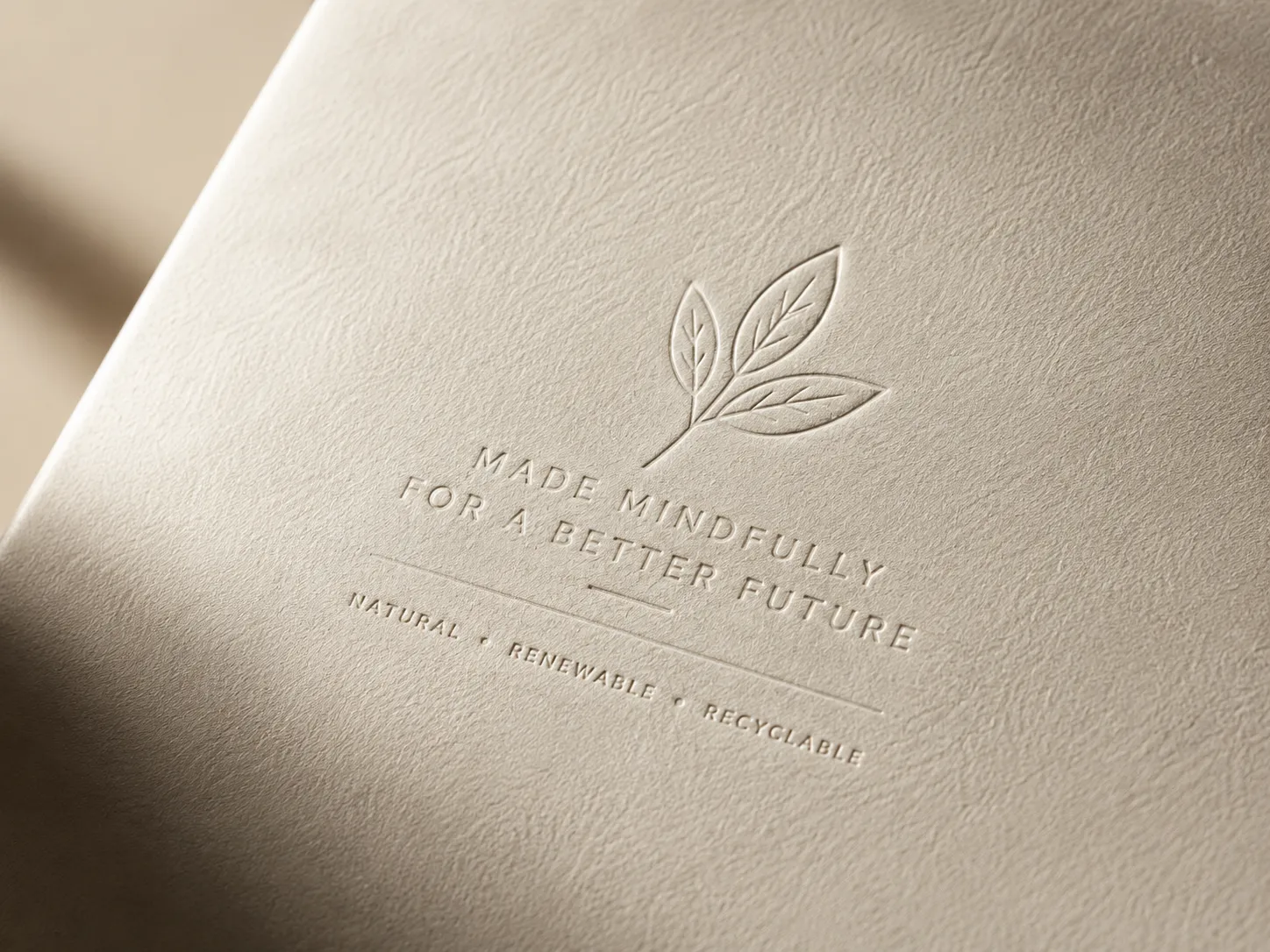 Close view of an embossed crest raised out of uncoated board, the shoulder of the die catching raking light