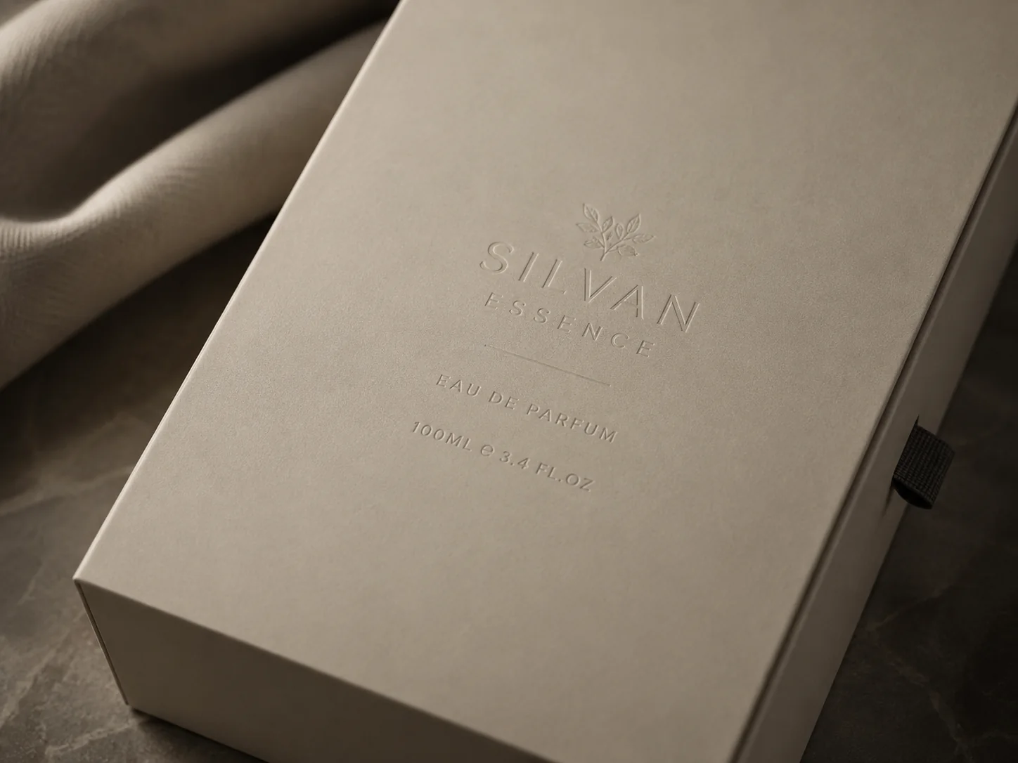 A matte laminated carton with a blind embossed mark, no glare anywhere across the face
