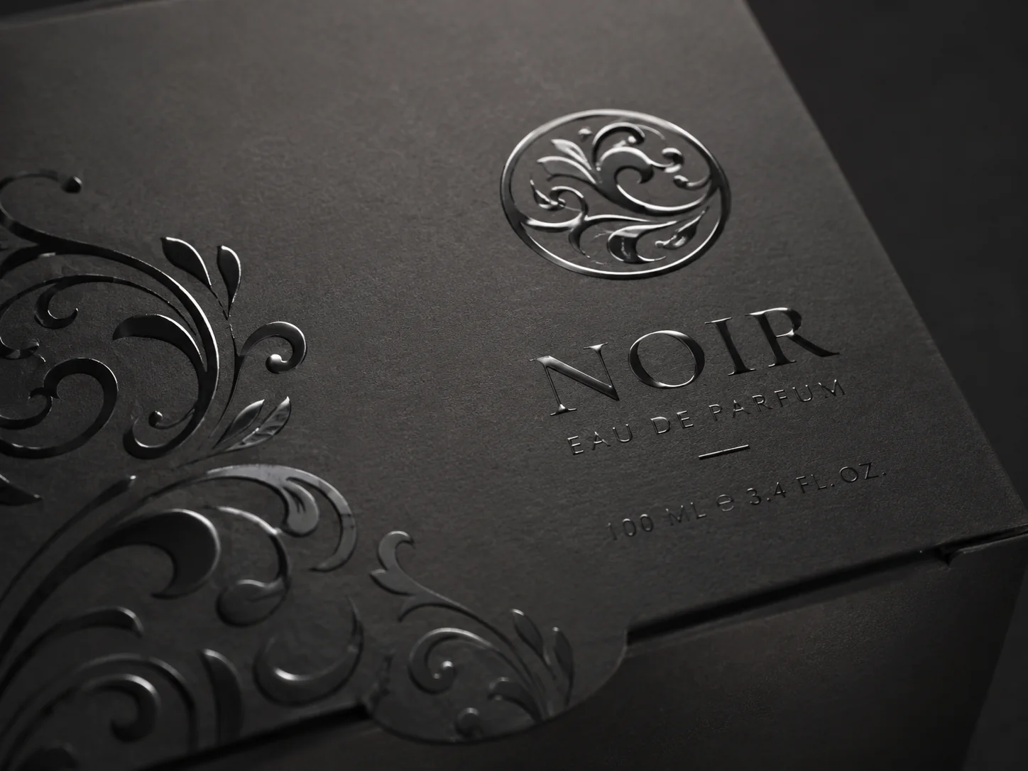 Gloss varnish raised over a matte laminated black panel, the pattern catching light the ground does not
