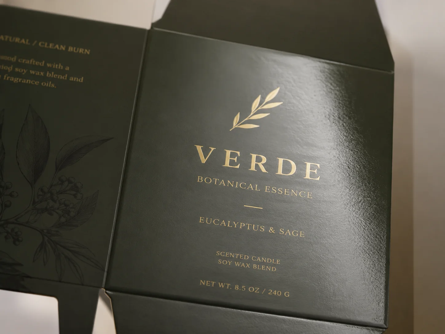 A UV coated carton in dark green, a hard even sheen carrying across the printed ground