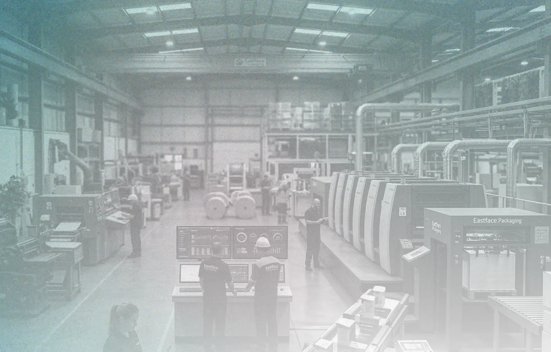 The plant floor in Ahmedabad, the press hall and the converting line running back under a clean ceiling.