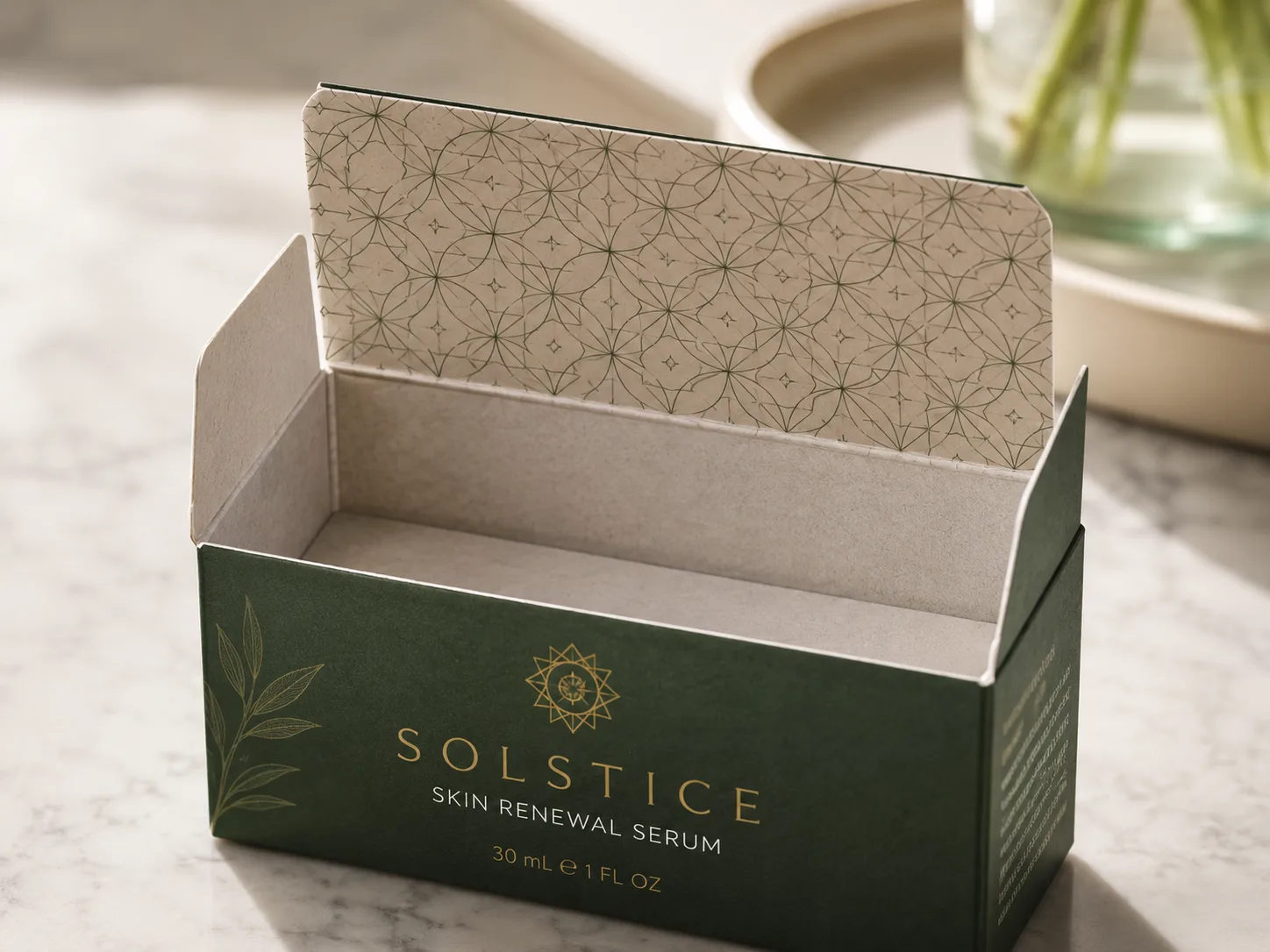 A green serum carton standing open, a fine printed pattern covering the inside of the lifted tuck flap