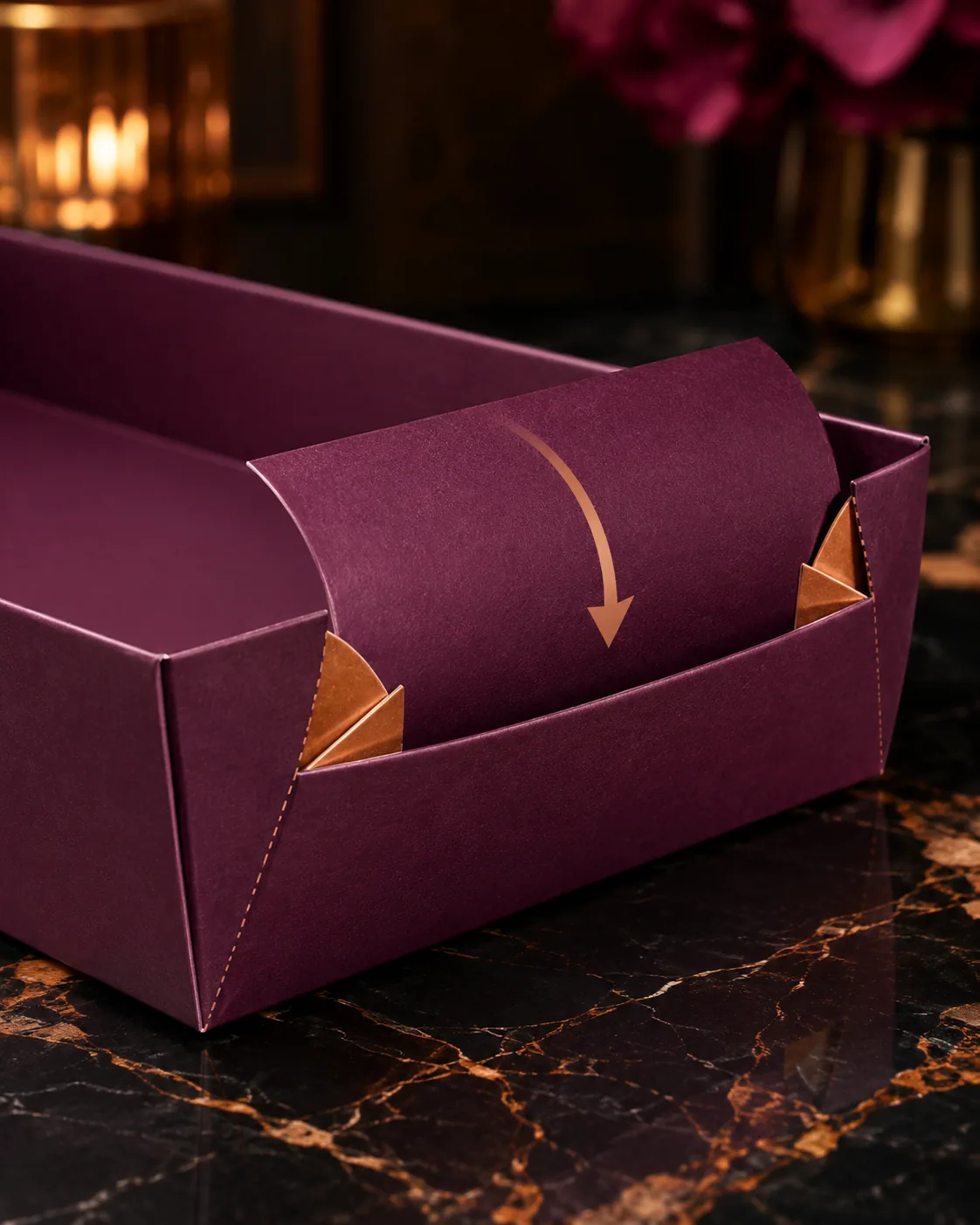 The end of a burgundy six corner tray mid return, the upper half swinging down the inside of the lower half over two gold ears.