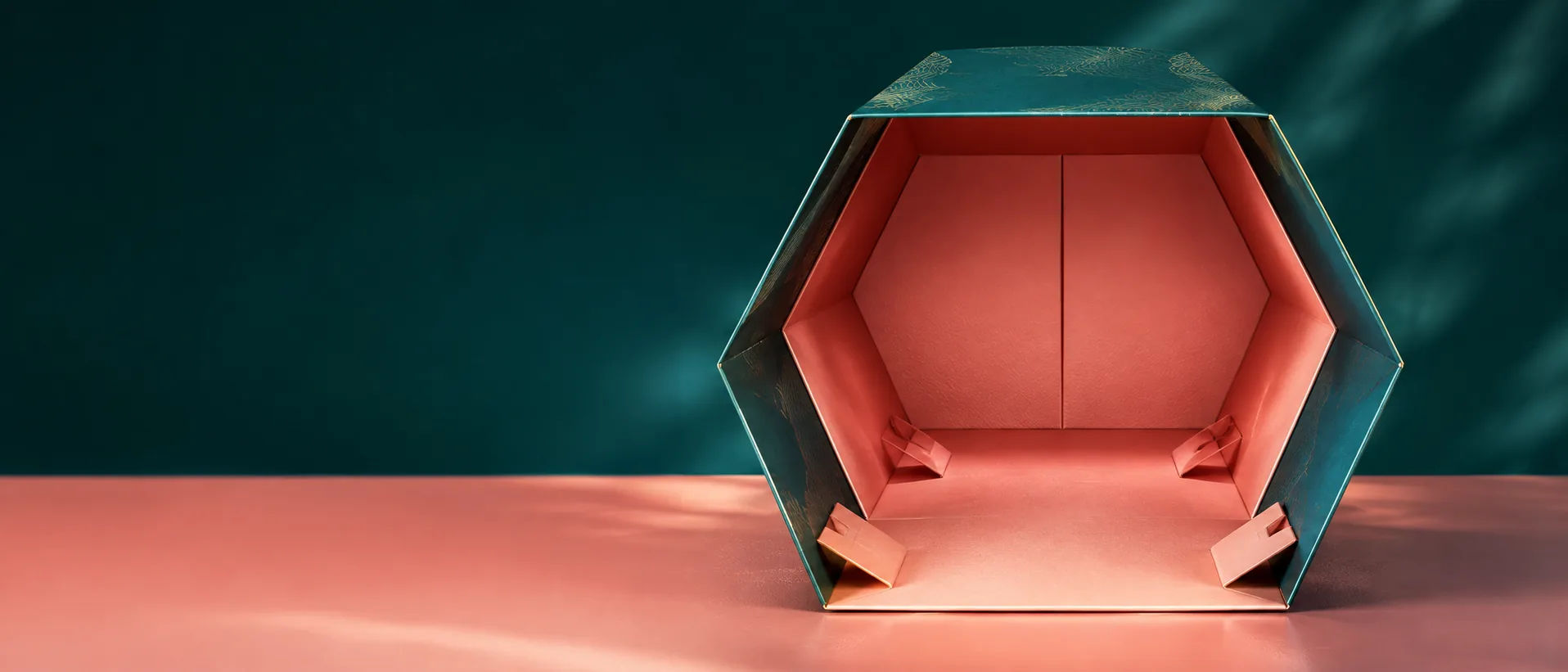 A wide low frame into an empty six corner tray, the doubled end wall at the far side and the ears along the base both in shot.