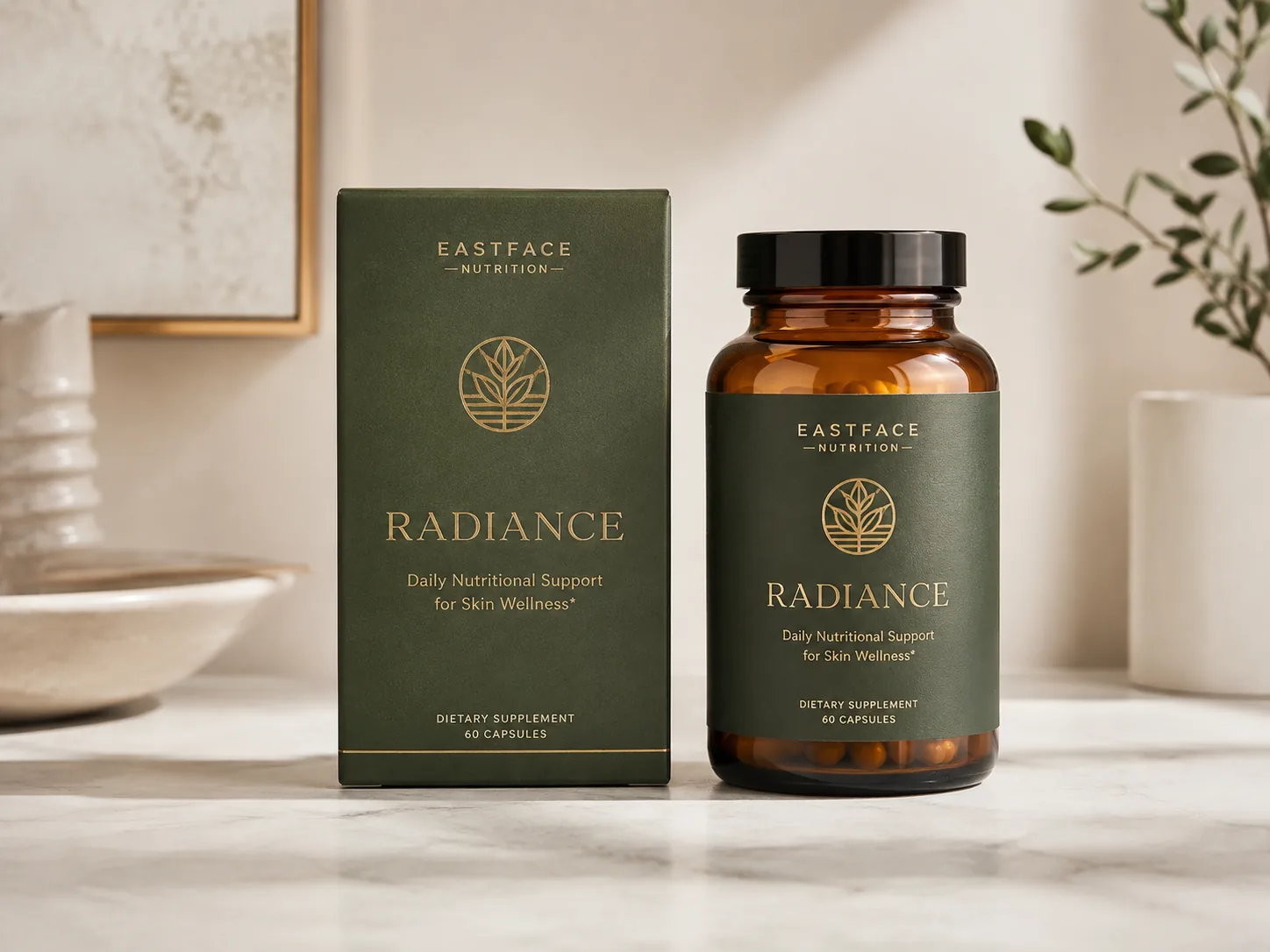 A deep green straight tuck end supplement carton standing square to camera on a marble counter beside its amber capsule bottle.