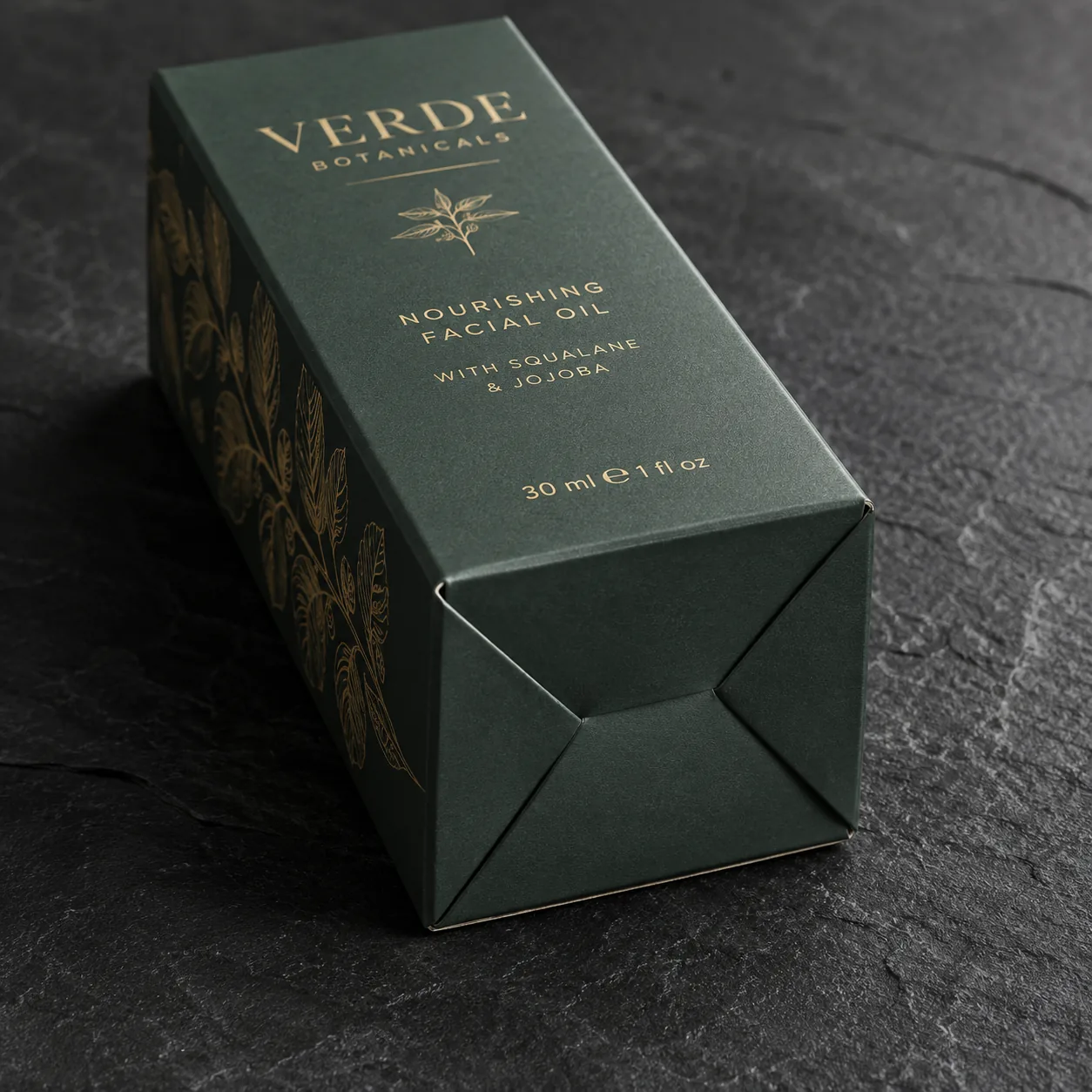 A green tuck top auto bottom carton tipped on its side, the four base panels lapped into a locked pinwheel